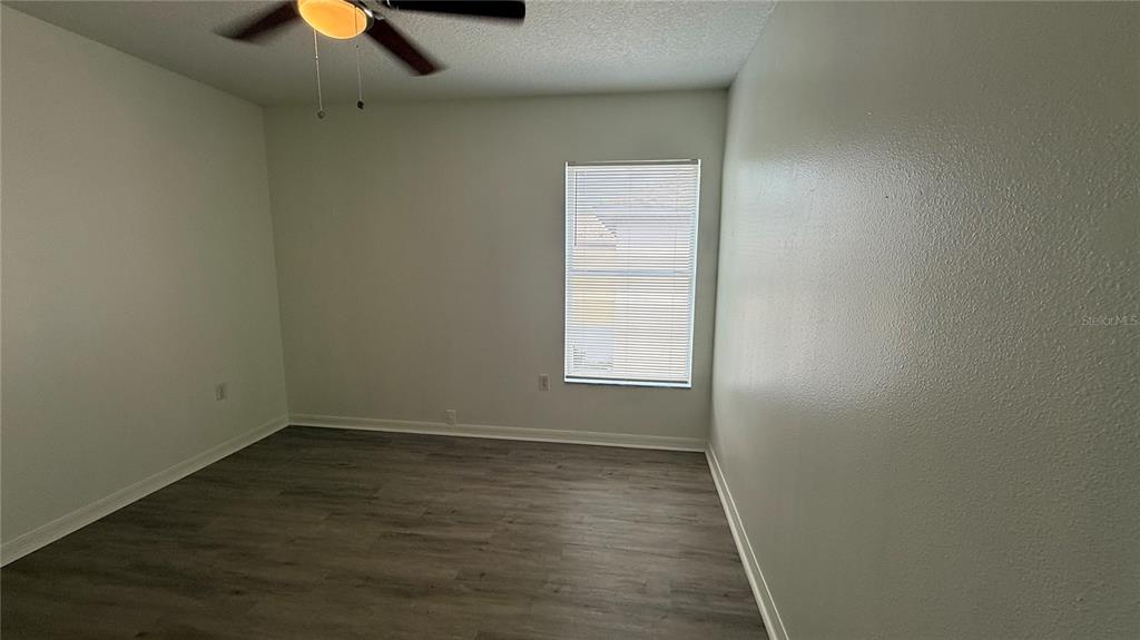 4484 Philadelphia Circle Kissimmee, FL 34746 - Photo 23 of 56 wooden floor in an empty room