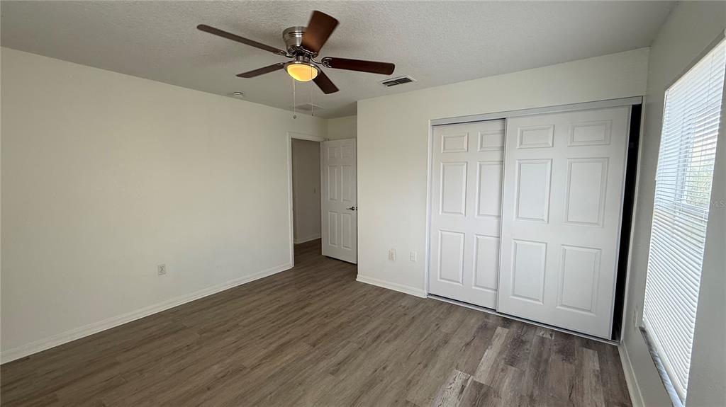 4484 Philadelphia Circle Kissimmee, FL 34746 - Photo 24 of 56 wooden floor in an empty room