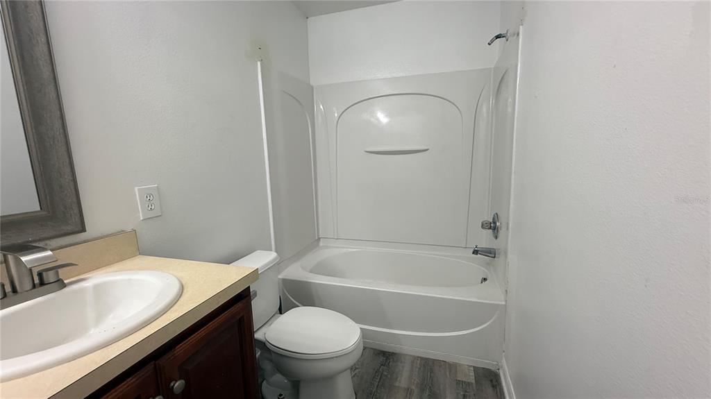 4484 Philadelphia Circle Kissimmee, FL 34746 - Photo 36 of 56 a bathroom with a sink toilet and bathtub