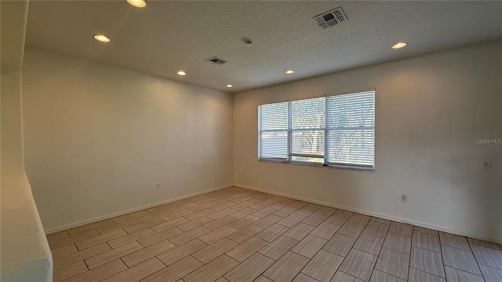4484 Philadelphia Circle Kissimmee, FL 34746 - Photo 40 of 56 a view of an empty room with a window