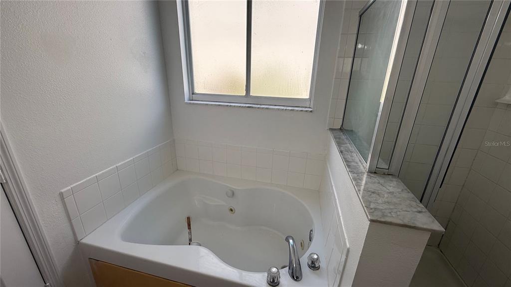 4484 Philadelphia Circle Kissimmee, FL 34746 - Photo 41 of 56 a bathroom with a bathtub