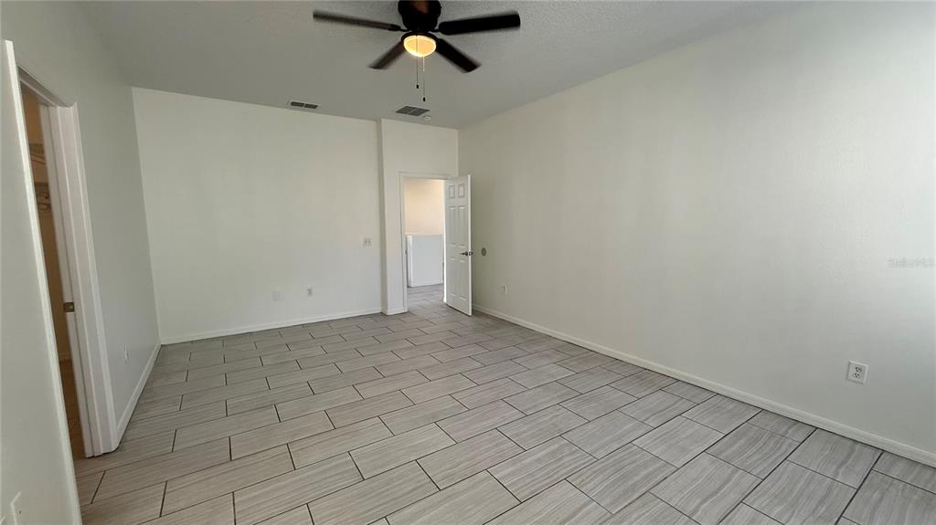 4484 Philadelphia Circle Kissimmee, FL 34746 - Photo 47 of 56 a view of a room with a ceiling fan