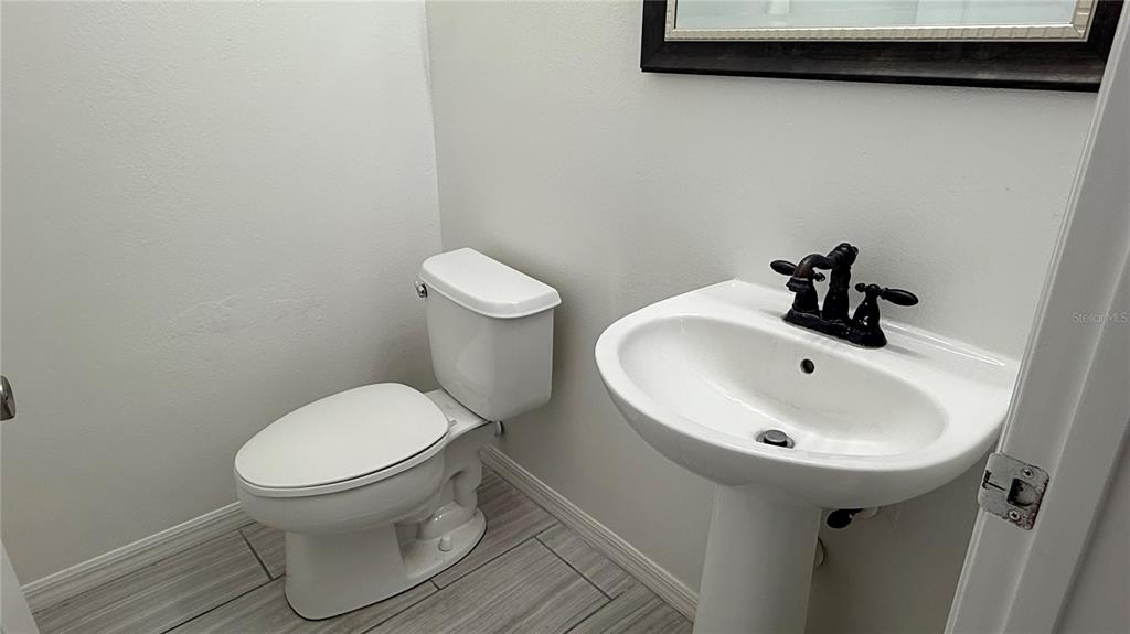 4484 Philadelphia Circle Kissimmee, FL 34746 - Photo 53 of 56 a bathroom with a sink and a toilet