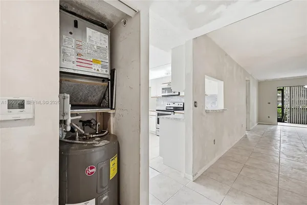 a bathroom with a sink toilet and a mirror