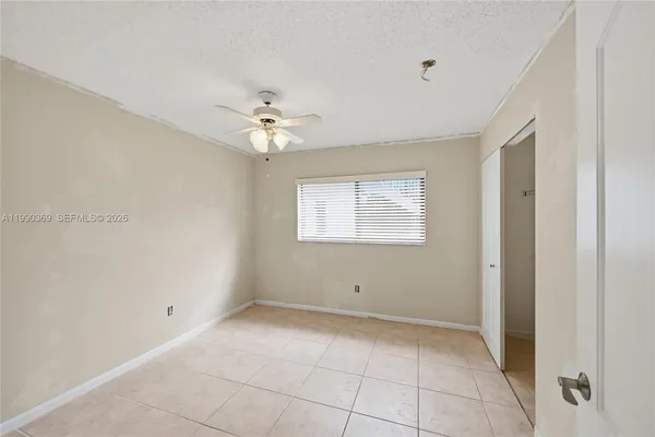 a view of a livingroom with a chandelier fan