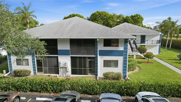an aerial view of a house with a swimming pool