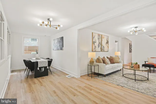 a view of a livingroom with furniture and wooden floor