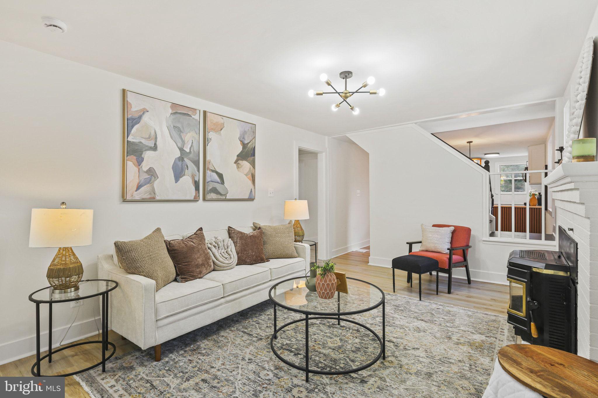 515 Freys Road Edgewood, MD 21040 - Photo 10 of 43 a living room with furniture a rug and a chandelier