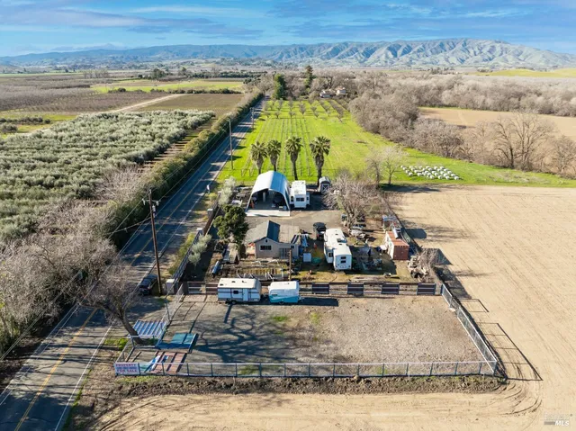 a view of a yard with an outdoor space