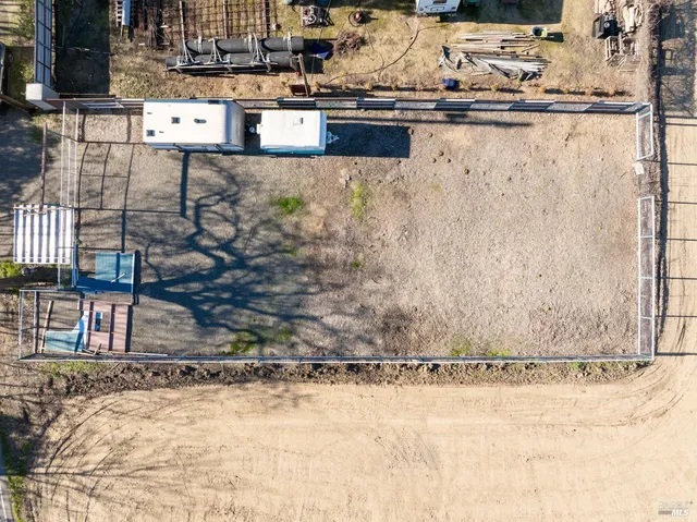 a sitting area with view of nearby houses