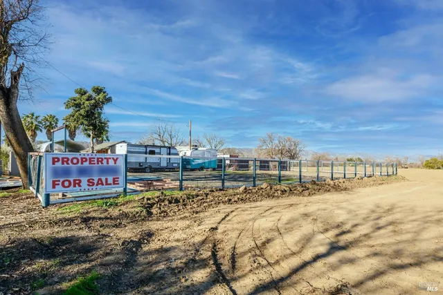 a view of a backyard of the house