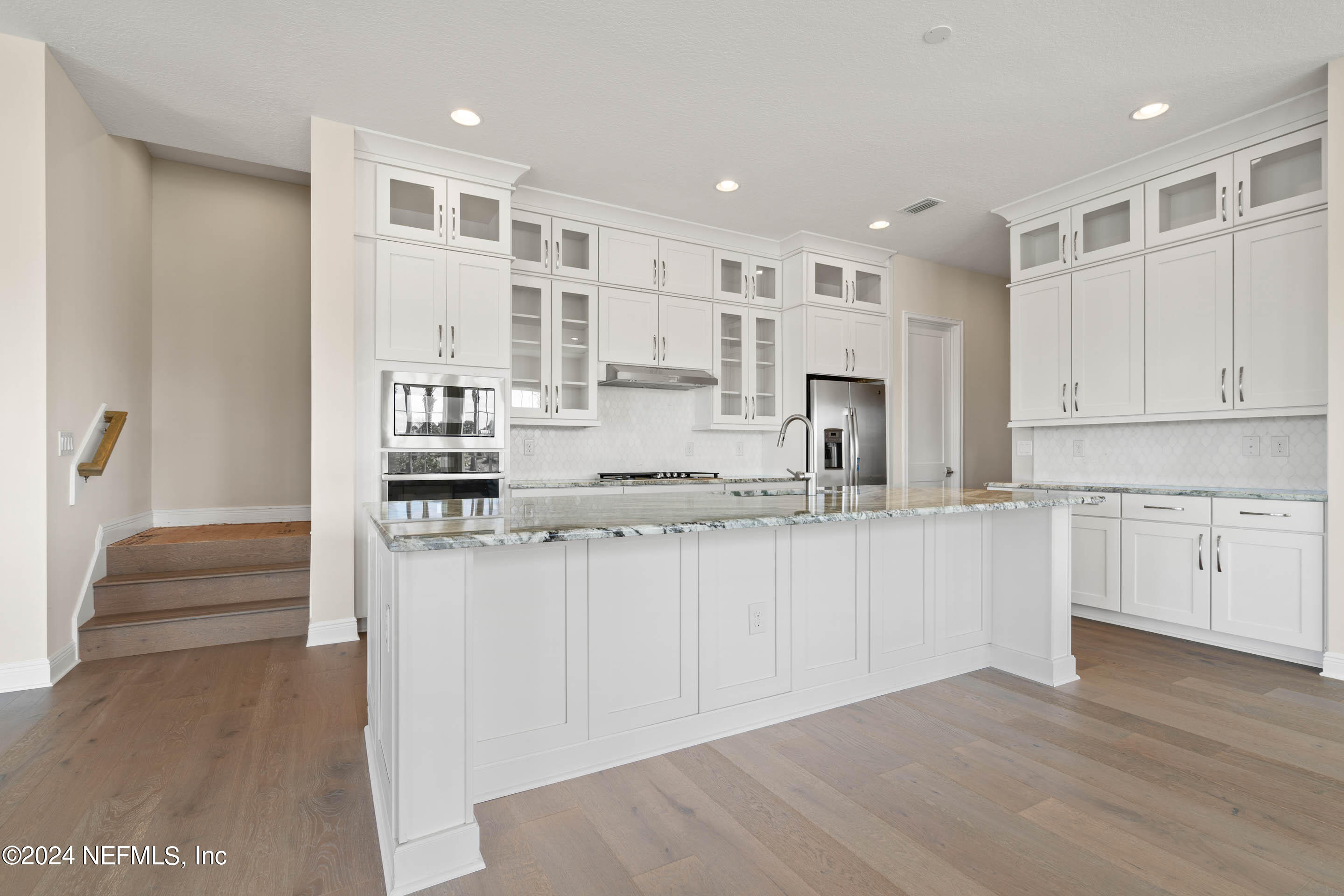 55 Rum Runner Way St. Johns, FL 32259 - Photo 12 of 55 a kitchen with stainless steel appliances granite countertop a refrigerator and cabinets