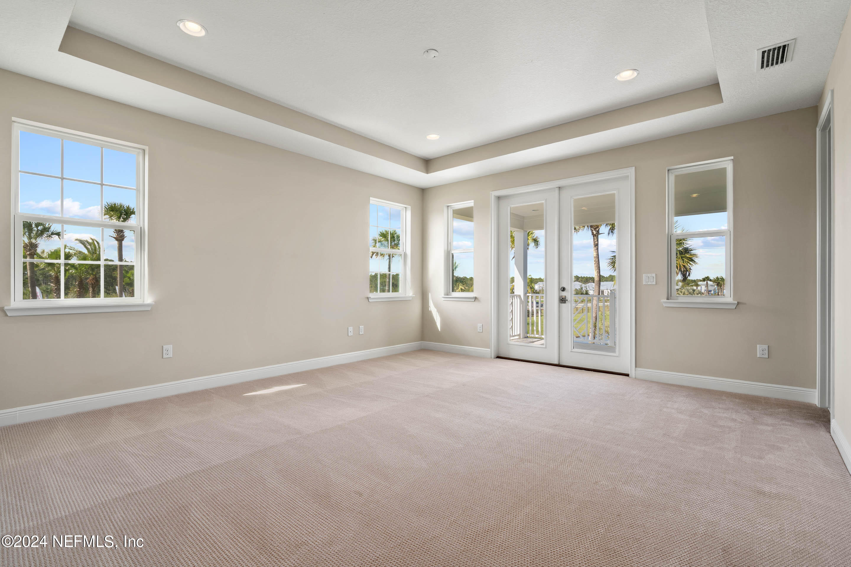 55 Rum Runner Way St. Johns, FL 32259 - Photo 20 of 55 an empty room with windows and view of kitchen
