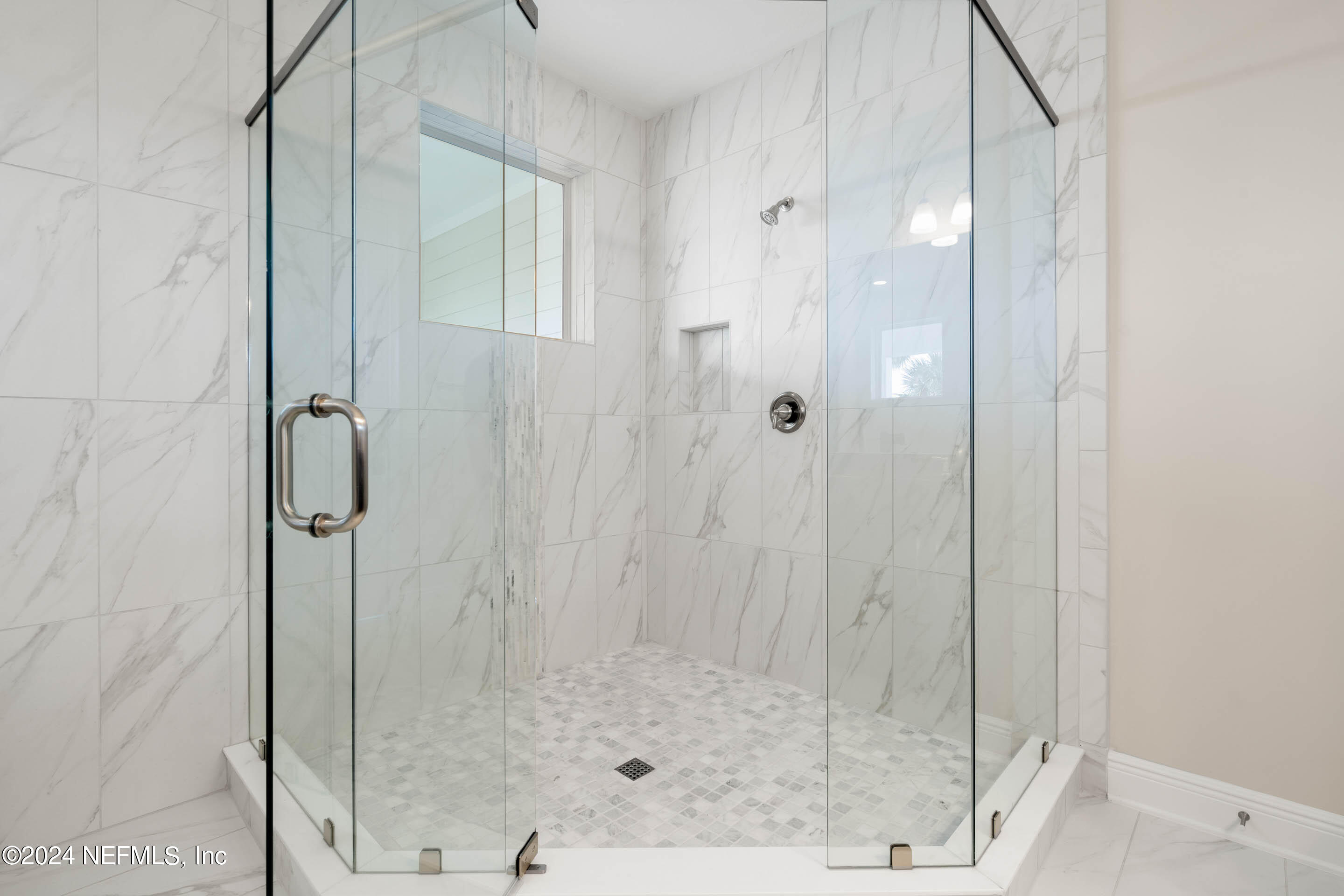 55 Rum Runner Way St. Johns, FL 32259 - Photo 26 of 55 a bathroom with a glass shower door