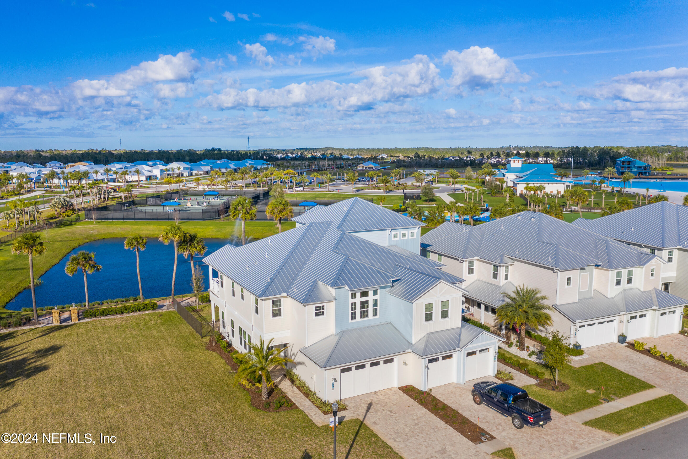 55 Rum Runner Way St. Johns, FL 32259 - Photo 3 of 55 a view of a city with lawn chairs under an umbrella