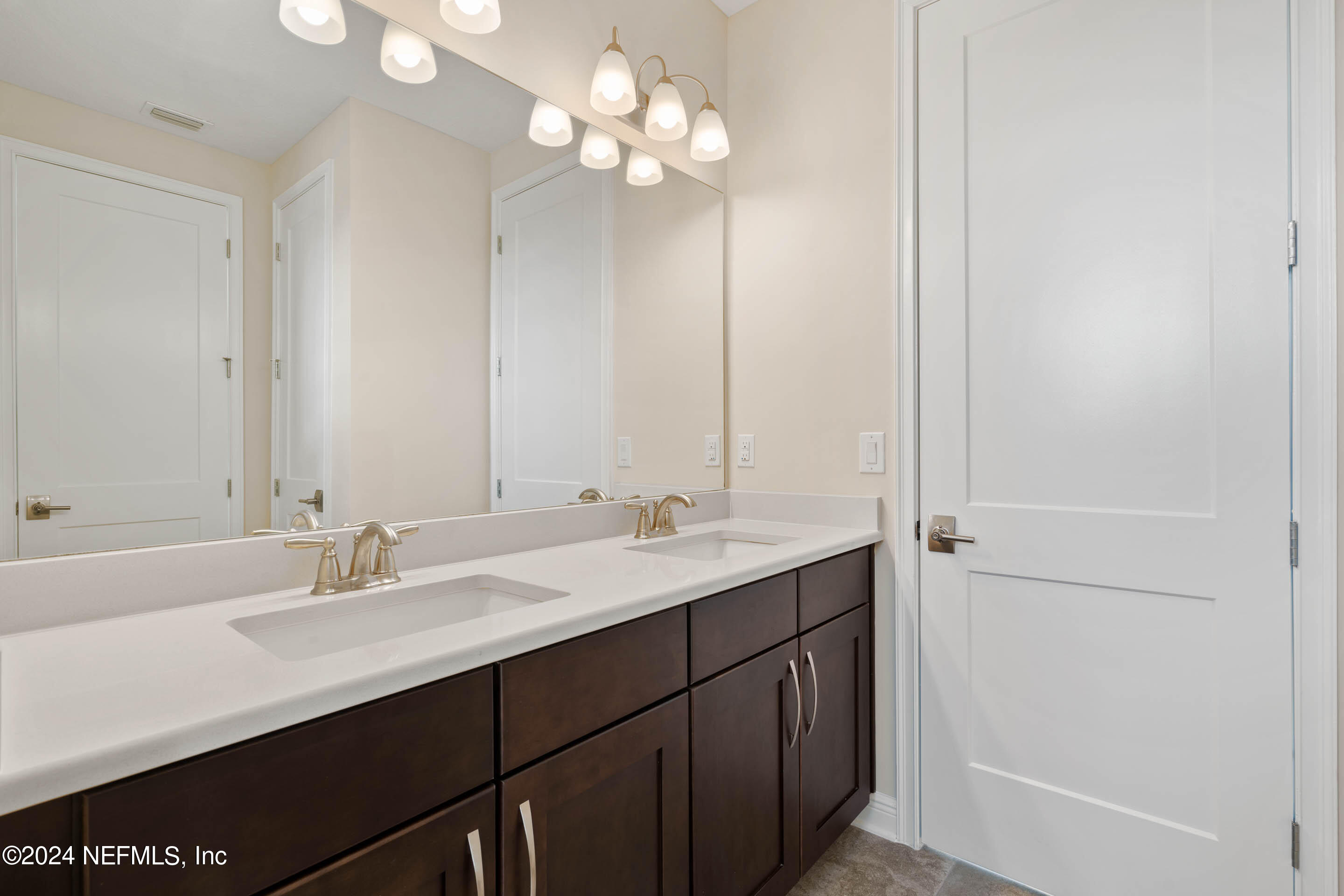 55 Rum Runner Way St. Johns, FL 32259 - Photo 33 of 55 a bathroom with a sink a light fixture and a mirror