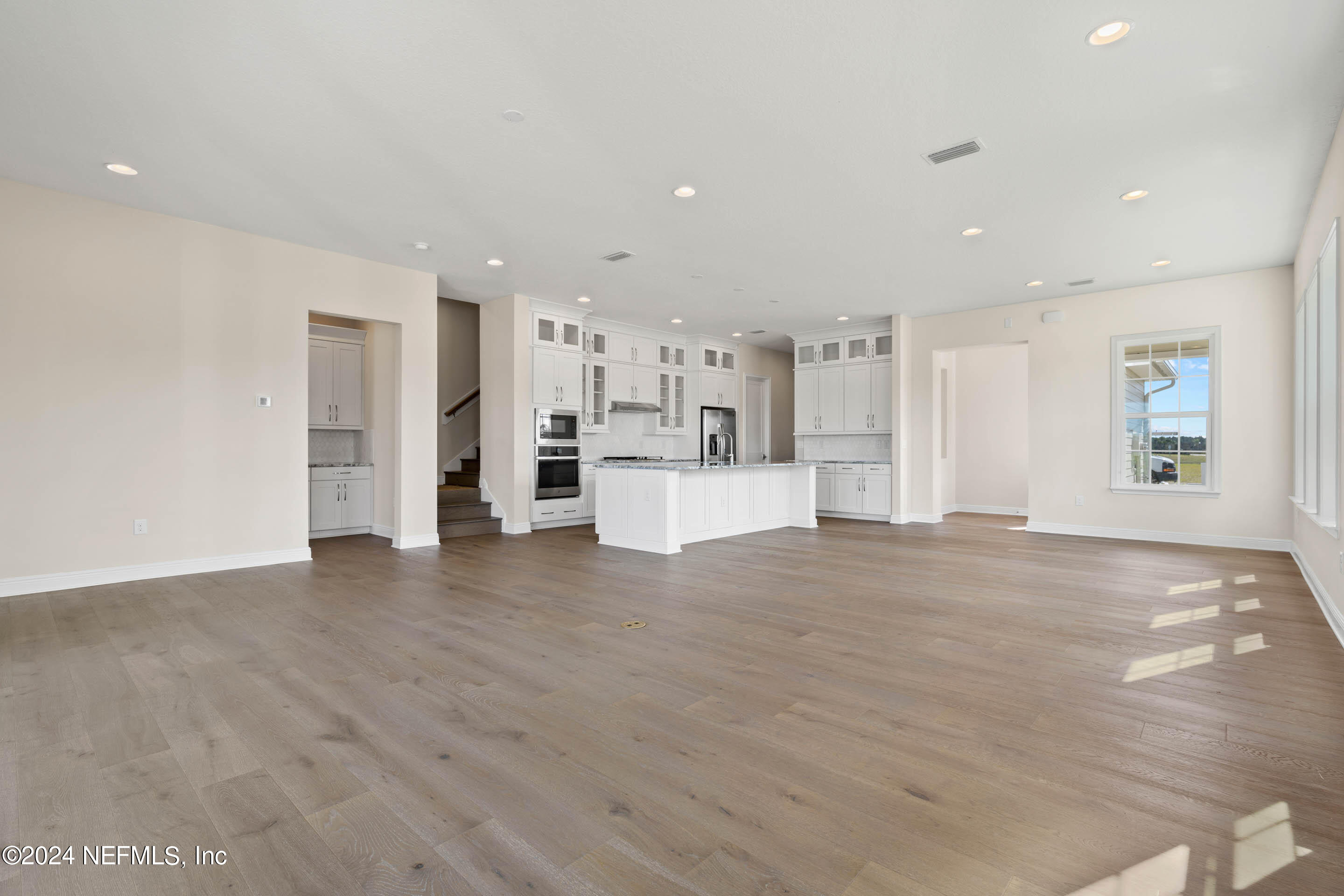 55 Rum Runner Way St. Johns, FL 32259 - Photo 8 of 55 a view of kitchen with refrigerator and white cabinets