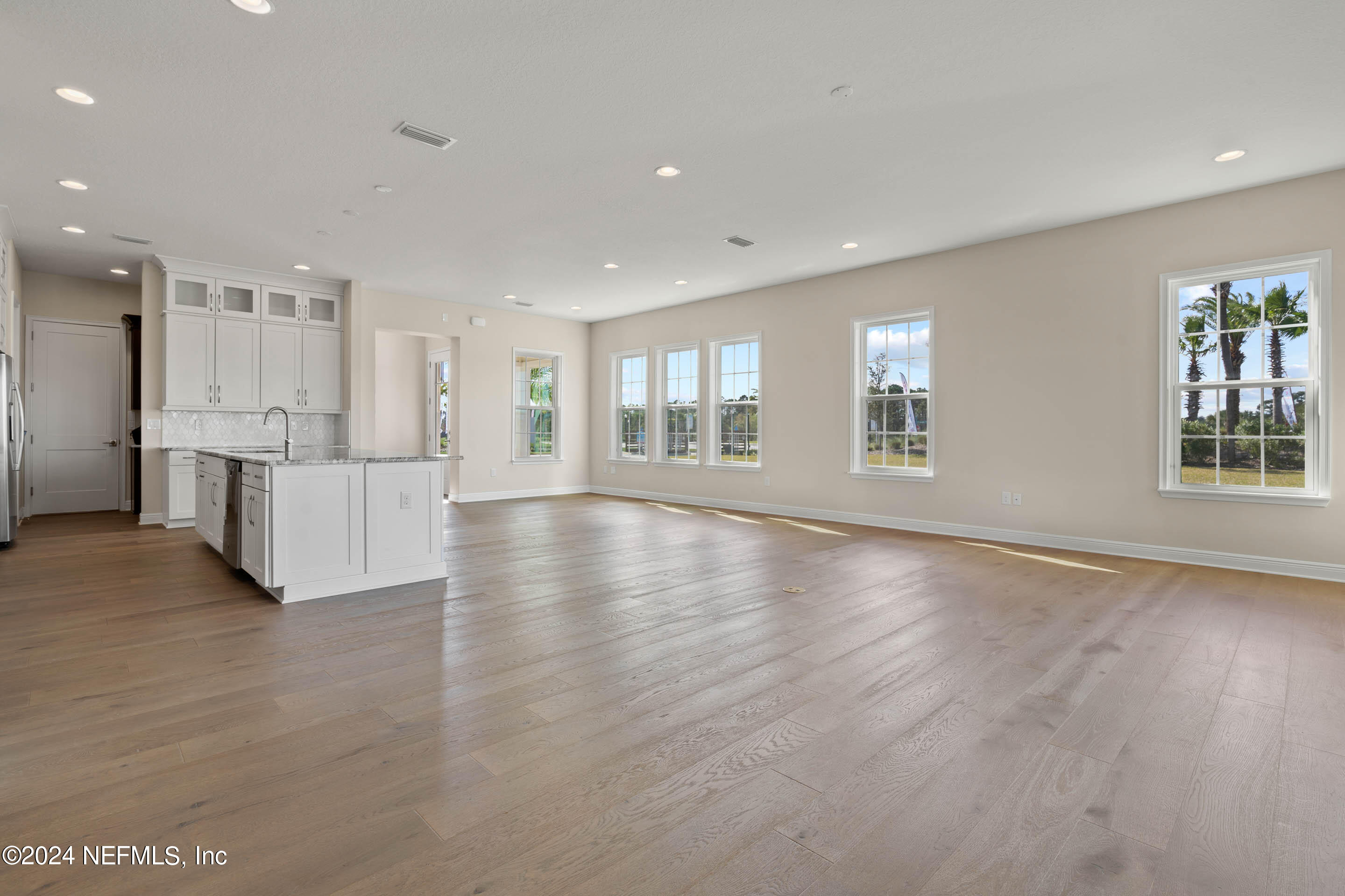 55 Rum Runner Way St. Johns, FL 32259 - Photo 9 of 55 a view of an empty room with a window and wooden floor