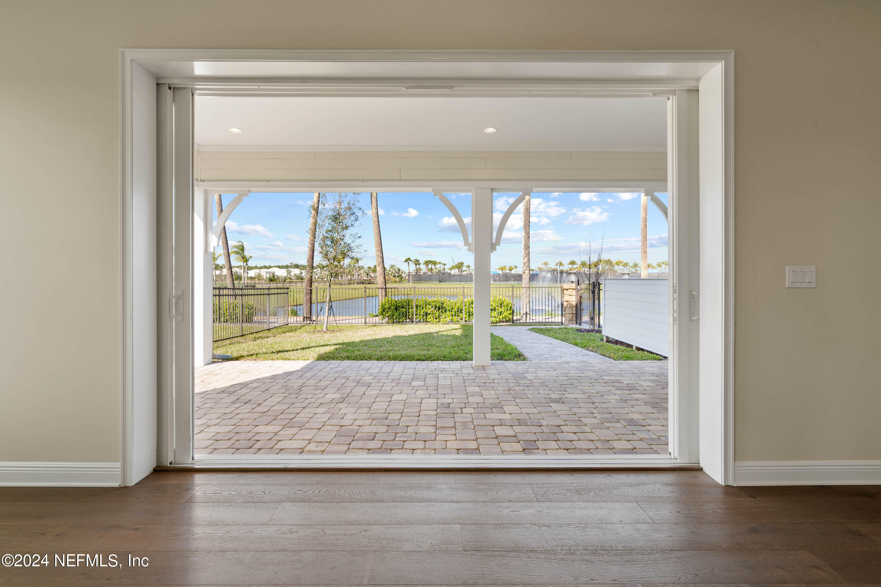 55 Rum Runner Way St. Johns, FL 32259 - Photo 10 of 55 a view of room with wooden floor and a floor to ceiling window