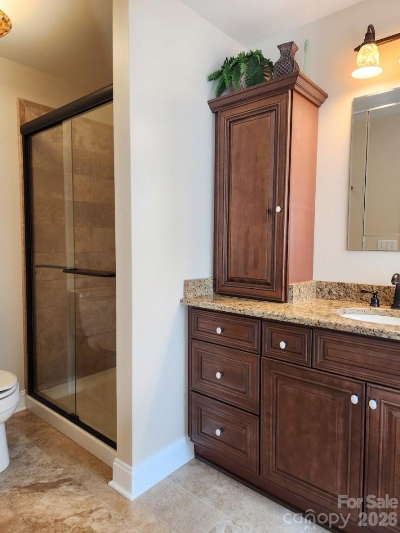 104 Rock Ridge Lane Mount Holly, NC 28120 - Photo 29 of 48 a bathroom with a sink and a mirror