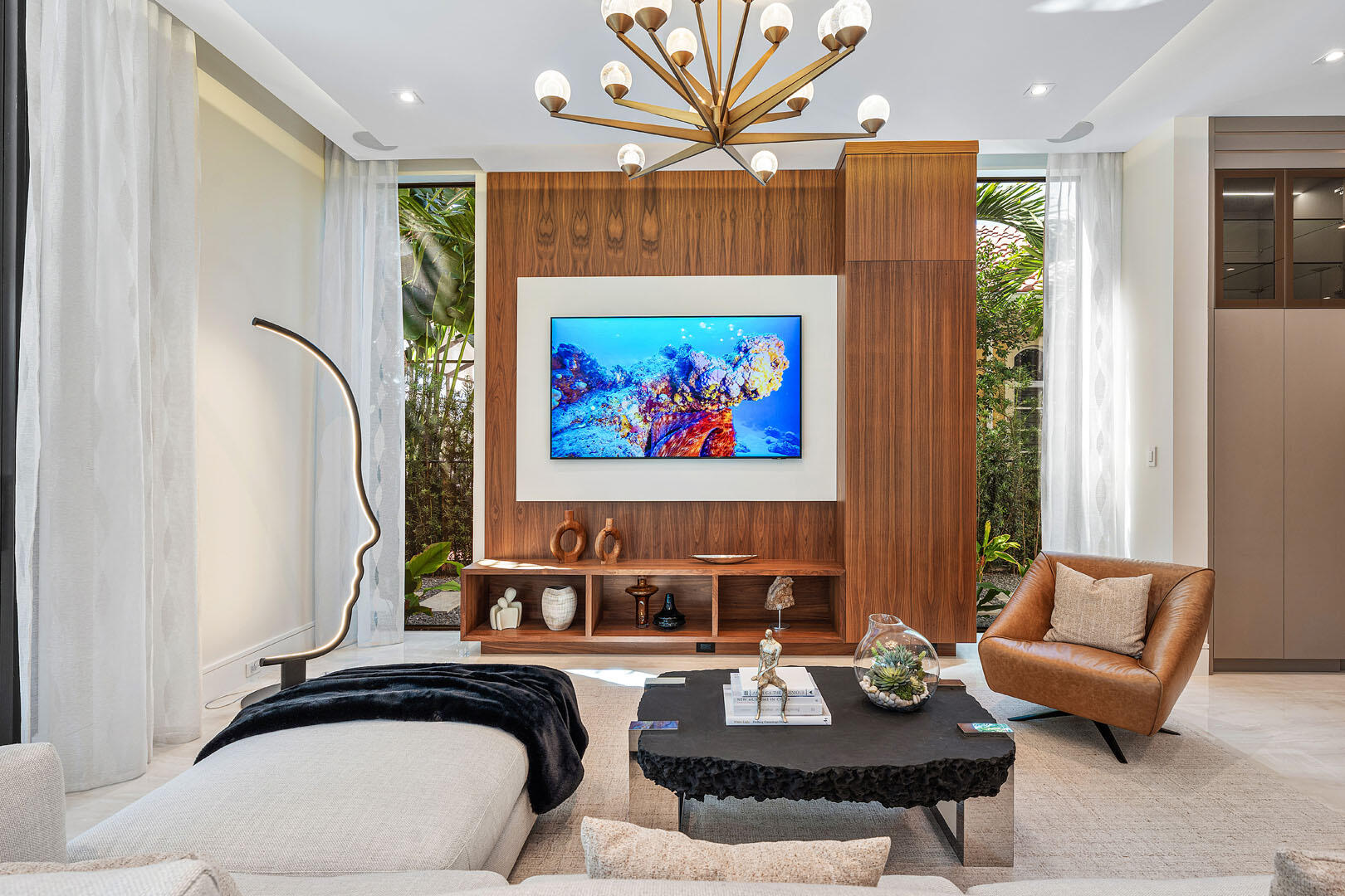 212 Alexander Palm Road Boca Raton, FL 33432 - Photo 19 of 75 a living room with furniture a rug and a painting