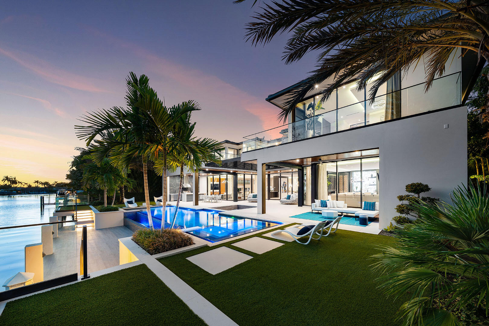 212 Alexander Palm Road Boca Raton, FL 33432 - Photo 68 of 75 a view of a house with swimming pool and sitting area