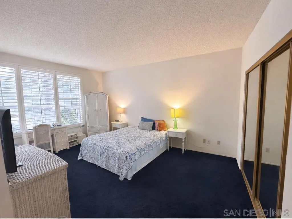 13078 Mindanao Way, Unit 101 Marina del Rey, CA 90292 - Photo 2 of 11 a bedroom with a bed and wooden floor