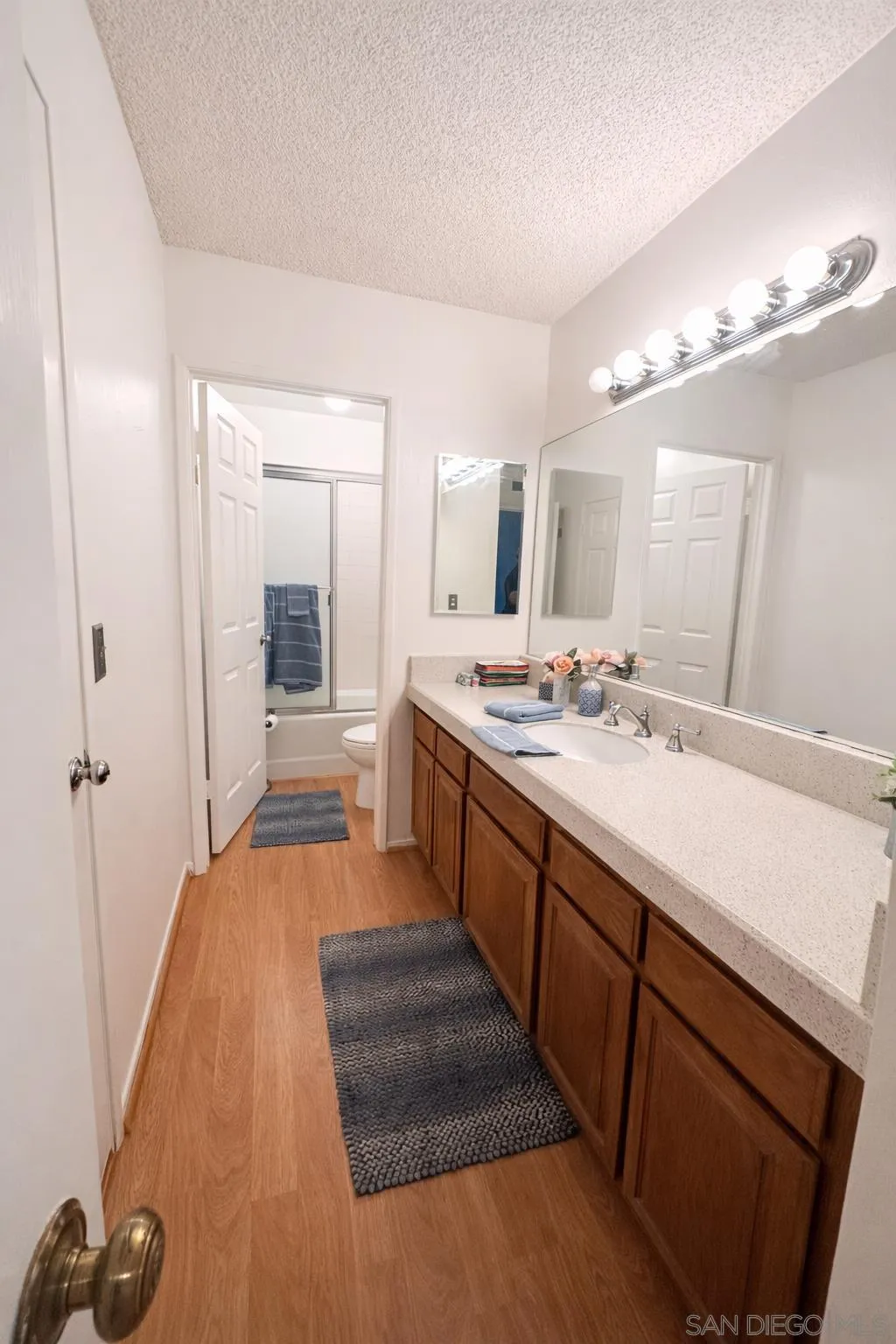 13078 Mindanao Way, Unit 101 Marina del Rey, CA 90292 - Photo 3 of 11 a spacious bathroom with a double vanity sink a mirror and a shower