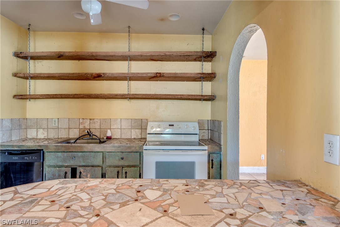 18481 Iris Road Fort Myers, FL 33967 - Photo 11 of 28 a view of a kitchen with a sink and a window
