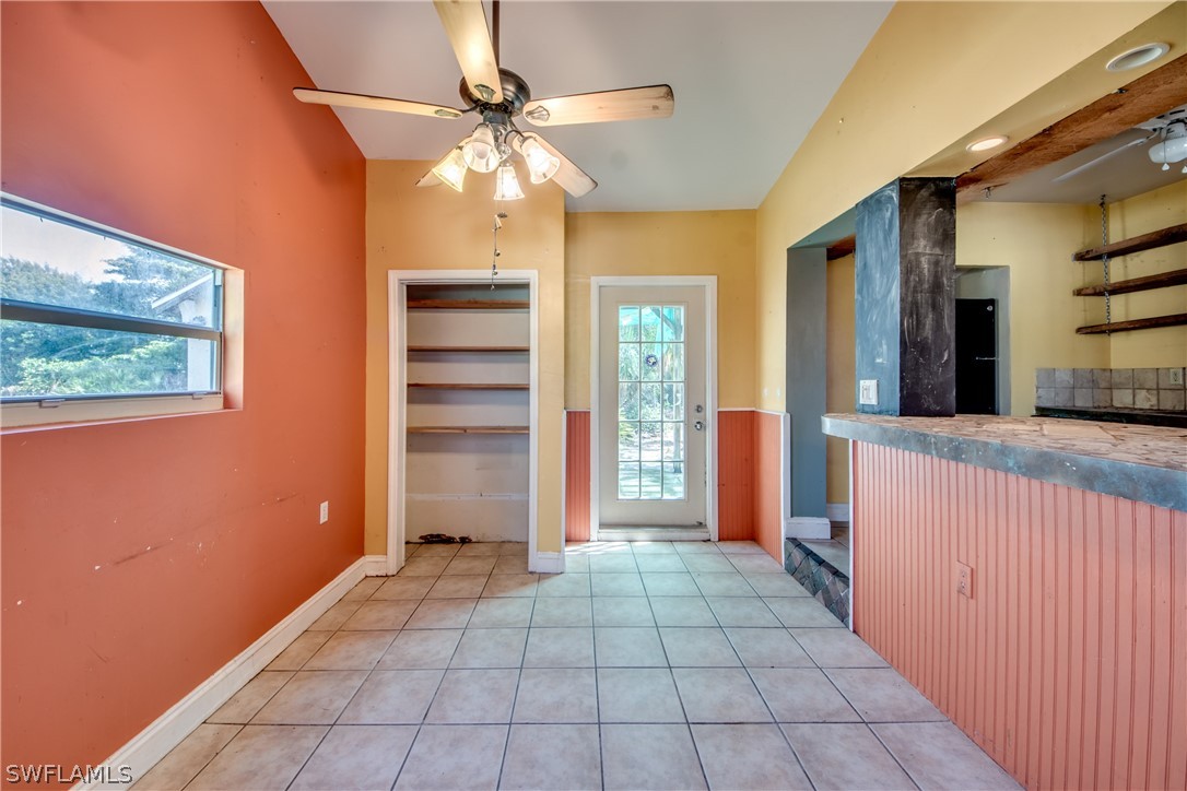 18481 Iris Road Fort Myers, FL 33967 - Photo 14 of 28 a view of a hallway with a chandelier