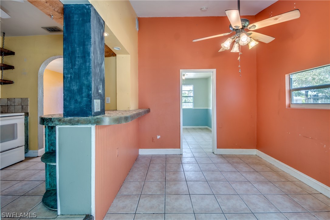 18481 Iris Road Fort Myers, FL 33967 - Photo 16 of 28 a view of a hallway with a chandelier