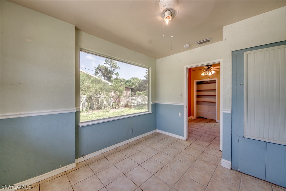 18481 Iris Road Fort Myers, FL 33967 - Photo 17 of 28 an empty room with windows and closet