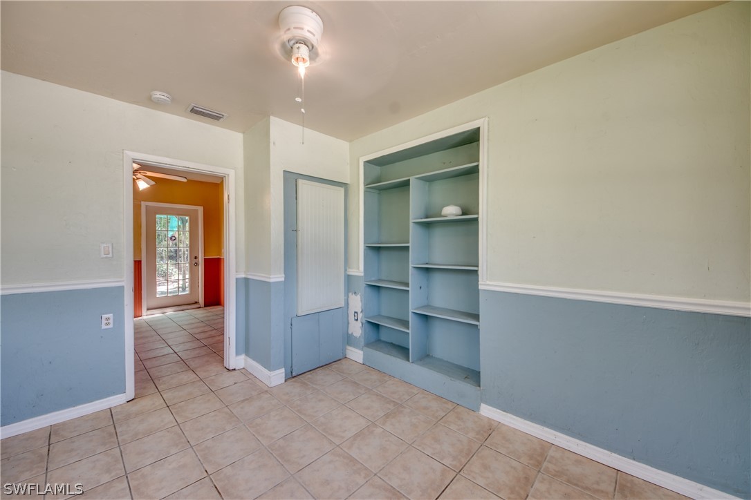 18481 Iris Road Fort Myers, FL 33967 - Photo 18 of 28 a view of a kitchen with refrigerator and cabinet
