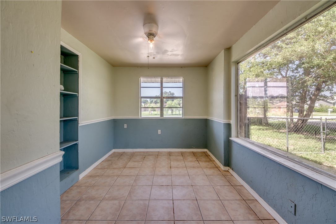 18481 Iris Road Fort Myers, FL 33967 - Photo 19 of 28 wooden floor in an empty room with a window
