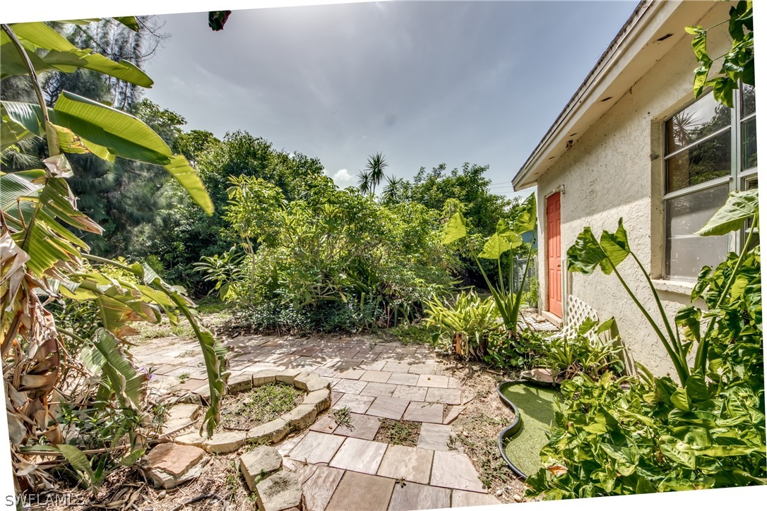 18481 Iris Road Fort Myers, FL 33967 - Photo 2 of 28 a view of a garden with plants