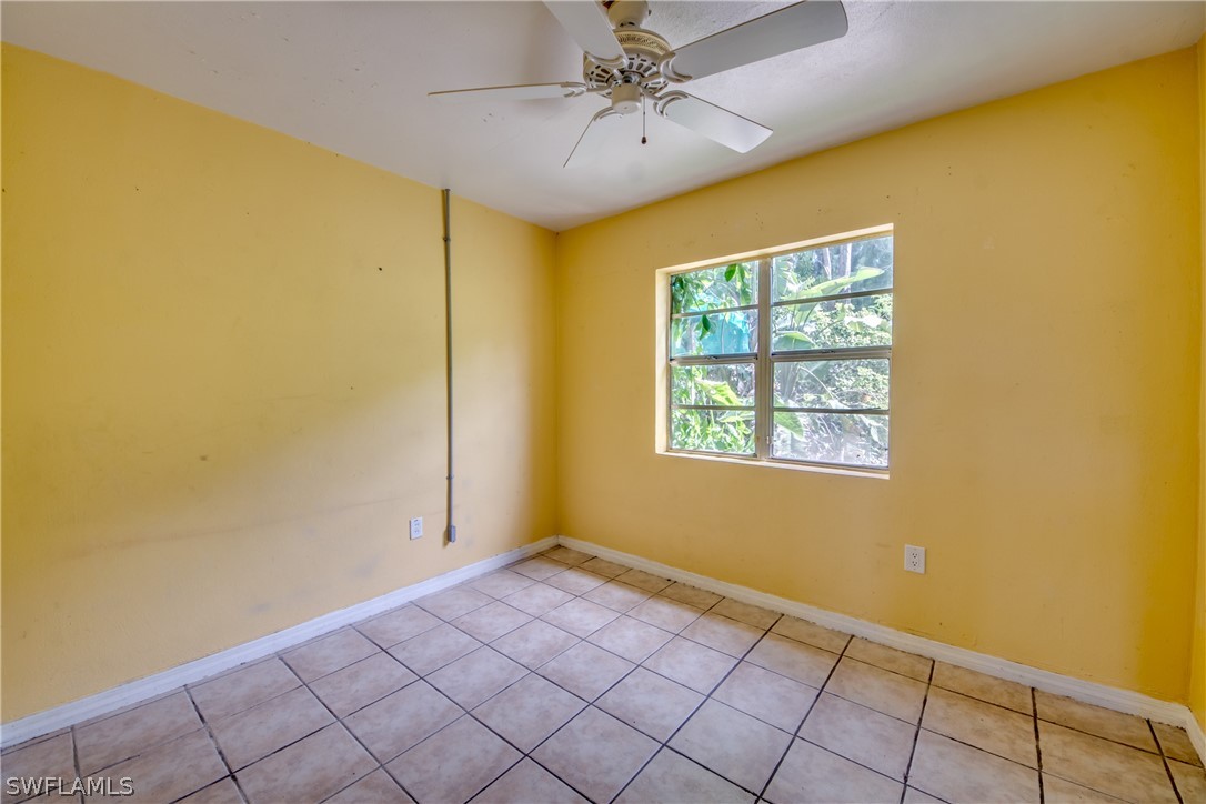 18481 Iris Road Fort Myers, FL 33967 - Photo 21 of 28 a view of an empty room with a window