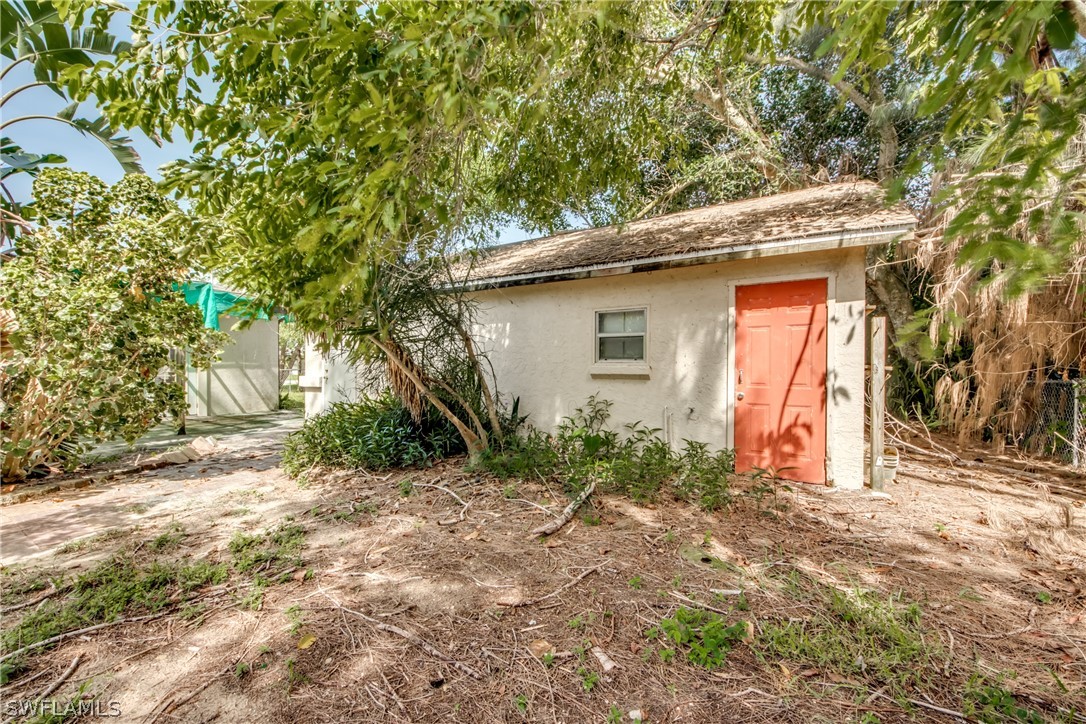 18481 Iris Road Fort Myers, FL 33967 - Photo 26 of 28 a small white house with a outdoor space