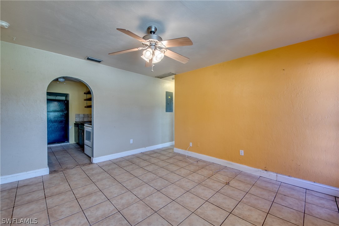 18481 Iris Road Fort Myers, FL 33967 - Photo 5 of 28 a view of an empty room with window and chandelier fan