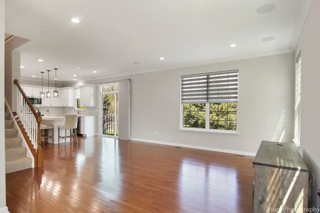 a view of a kitchen with furniture and wooden floor