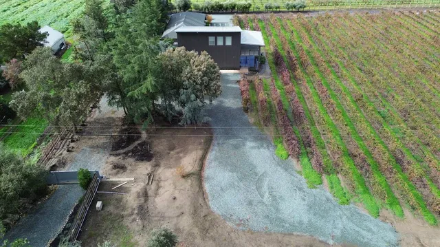 a view of a hallway with paintings on the wall