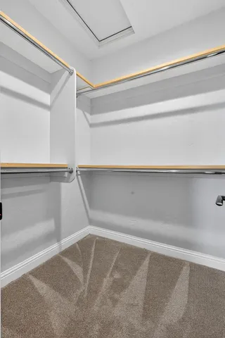 a view of a livingroom with furniture and a ceiling fan