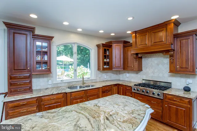 a kitchen with sink cabinets and window