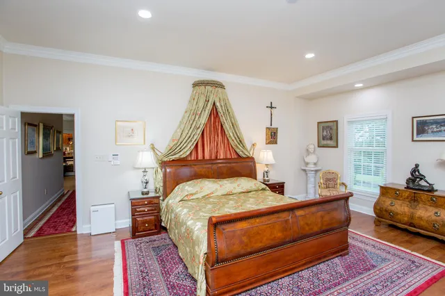 a view of a room with windows and furniture