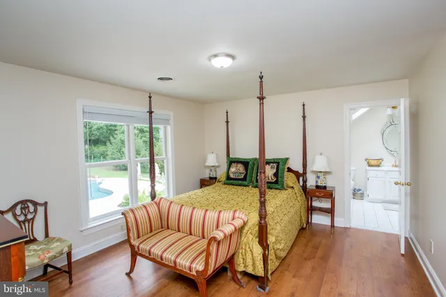 a living room with furniture a rug and a window