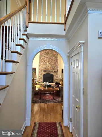 a living room with fireplace furniture and a fireplace