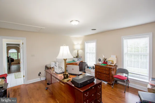 a view of staircase with wooden floor and windows