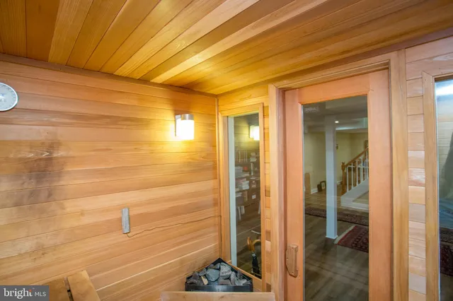 a view of a patio with chairs and a small yard