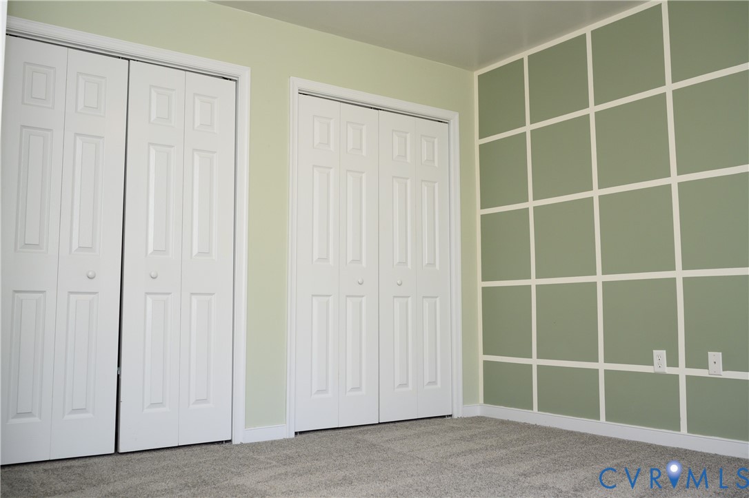 2143 Mountain View Road Powhatan, VA 23139 - Photo 11 of 34 a view of an empty room with wooden floor and cabinet