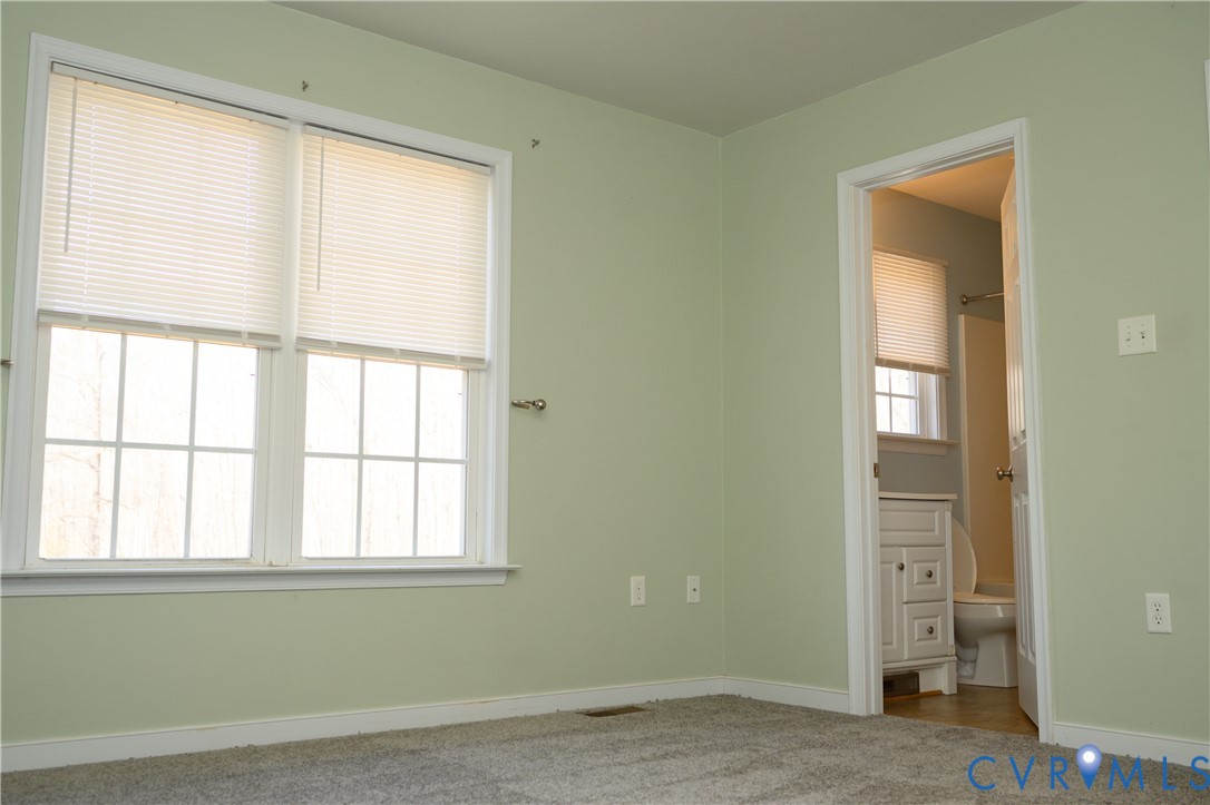 2143 Mountain View Road Powhatan, VA 23139 - Photo 12 of 34 an empty room with windows and closet