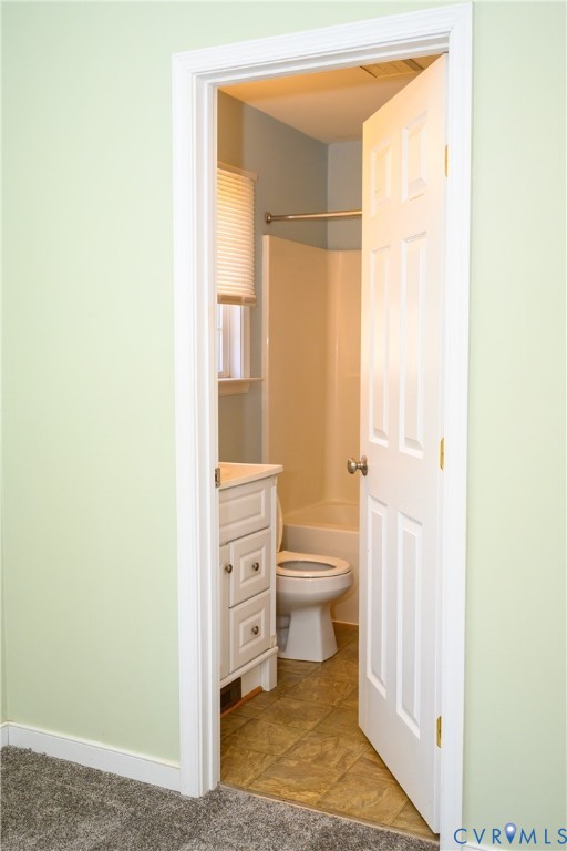 2143 Mountain View Road Powhatan, VA 23139 - Photo 13 of 34 a bathroom with a toilet a sink and a window